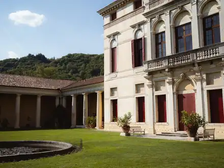 The front and lawn of a Palladian villa