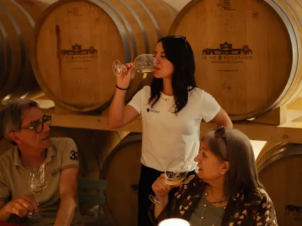 Two guests at a wine tasting by lamplight