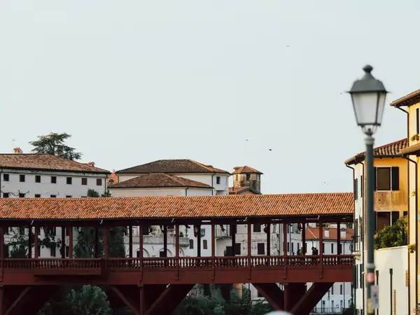 The covered wooden Ponte degli Alpini, with the old town behind