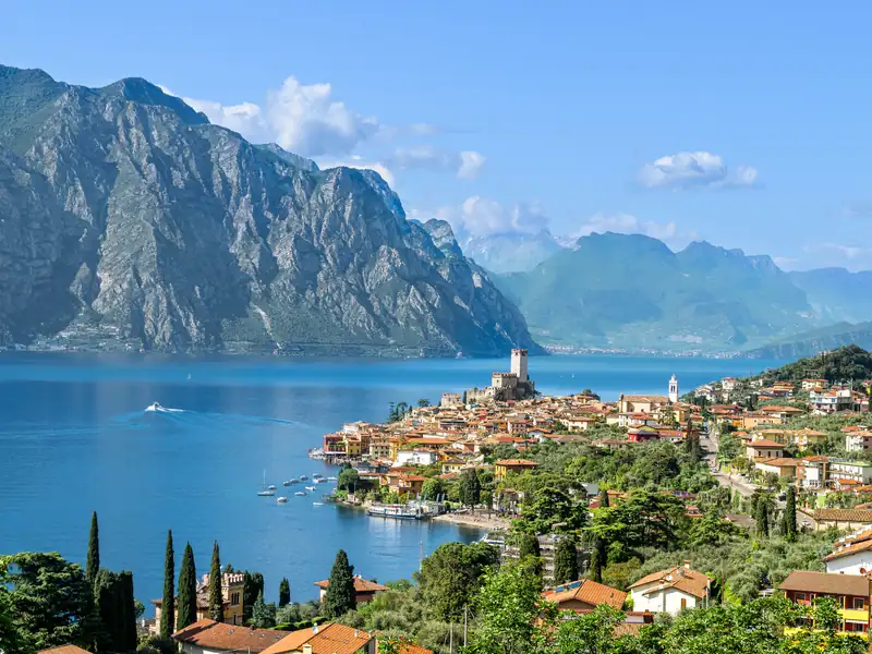 A lakeside town on Lake Garda, with mountains across the water