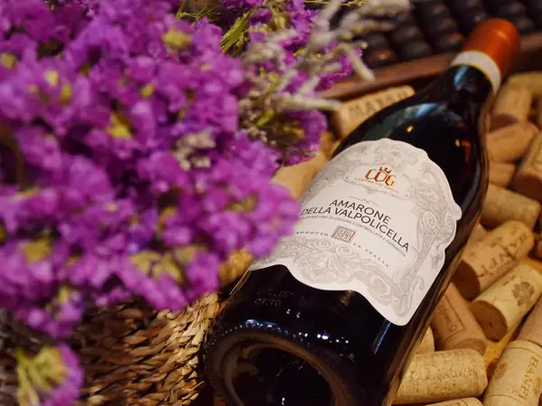 A bottle of Amarone della Valpolicella among corks and lavender