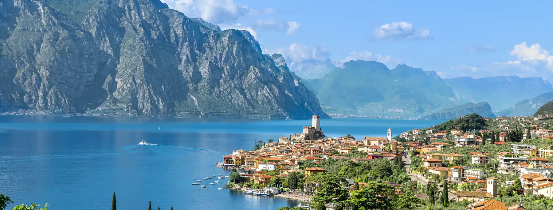 A lakeside town on Lake Garda, with mountains across the water