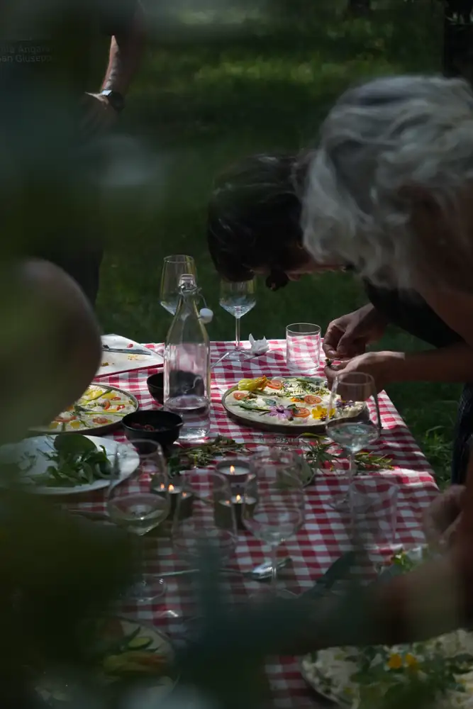 The table laid in the garden with focaccia, wine and water
