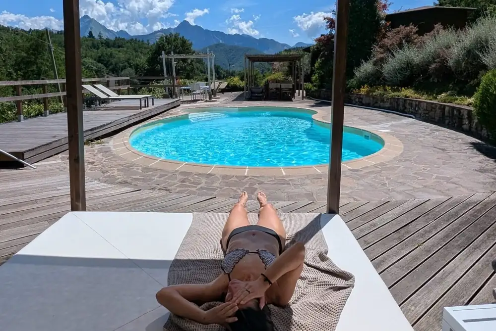 The swimming pool at Spino Fiorito, with the mountains behind