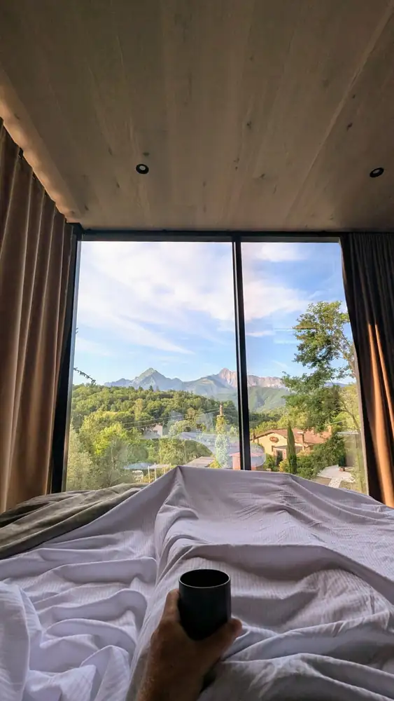 Morning light through the window of the mirror house, from the bed