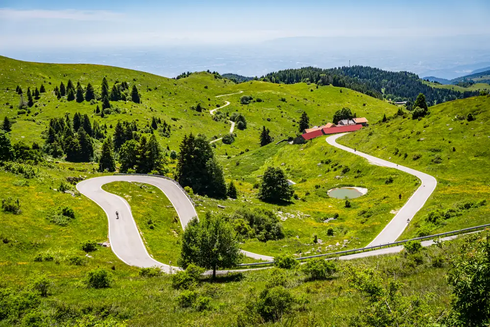 Road cycling up Monte Grappa from Bassano del Grappa - aerial view of the mountain roads