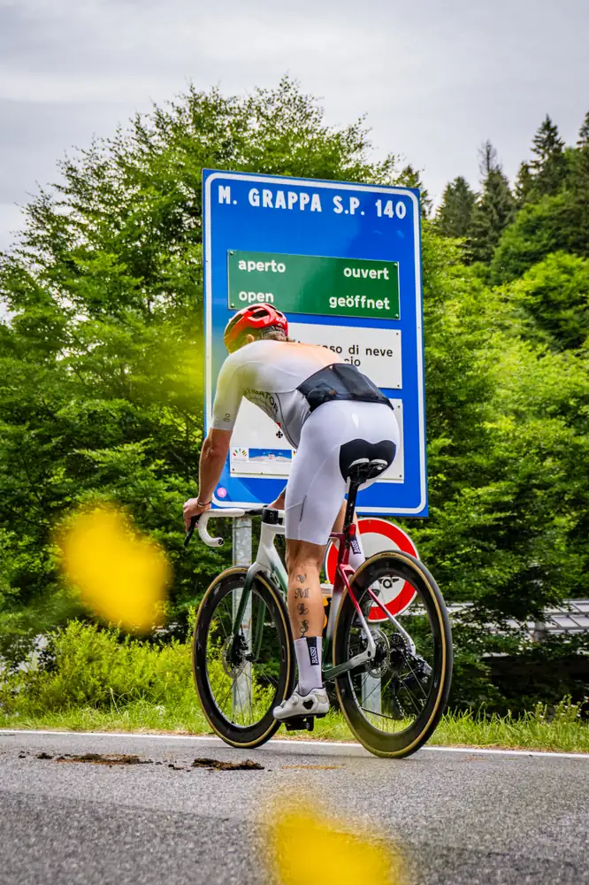 Cyclist on Monte Grappa cycling routes - road cycling up Monte Grappa