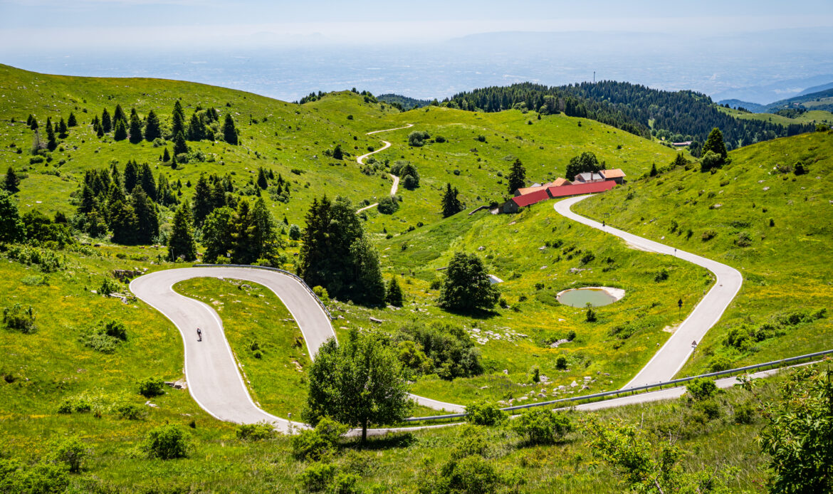 Road cycling up Monte Grappa from Bassano del Grappa - aerial view of the mountain roads