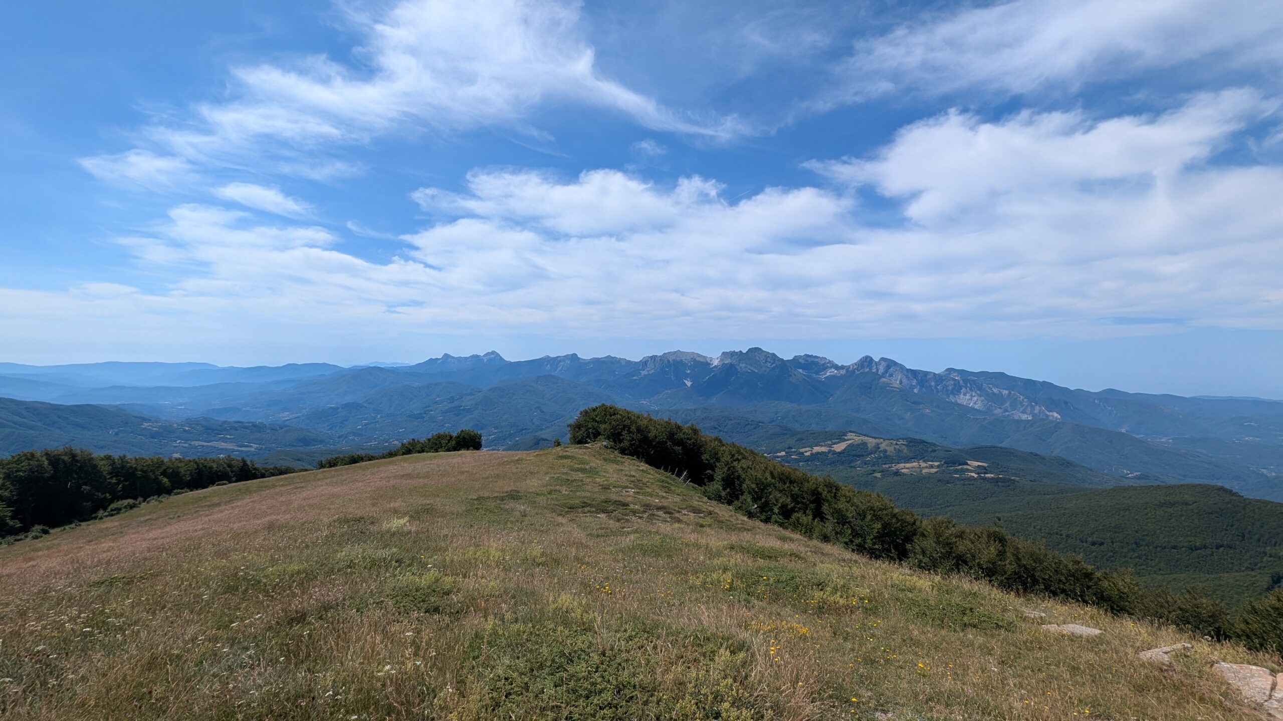 A quiet gravel road through the hills of Lunigiana